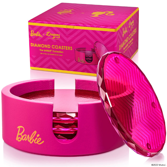 Set of four pink Barbie™ x Dragon Glassware® faceted crystal glass coasters displayed in a matching pink holder with Barbie™ logo and gift box.