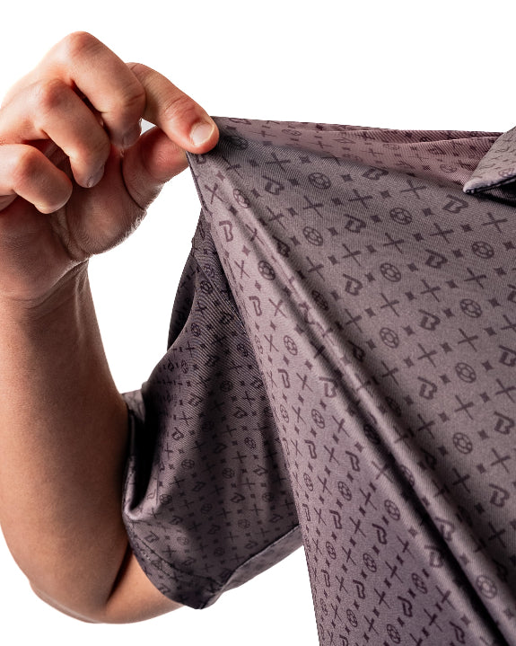 Pins & Aces x Blazy Susan men’s performance golf polo featuring a lightweight stretch design, short sleeves, and athletic golf fit.