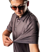 Pins & Aces x Blazy Susan men’s performance golf polo featuring a lightweight stretch design, short sleeves, and athletic golf fit.