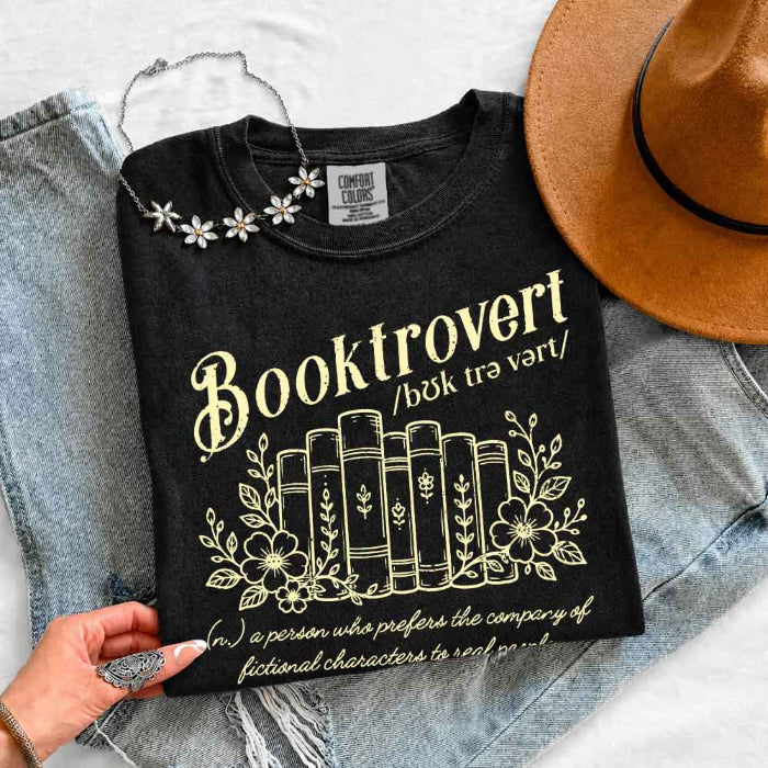 Booktrovert Comfort Colors T-shirt featuring a playful book lover graphic on a relaxed garment-dyed 100% cotton tee for readers and bookworms in color Black