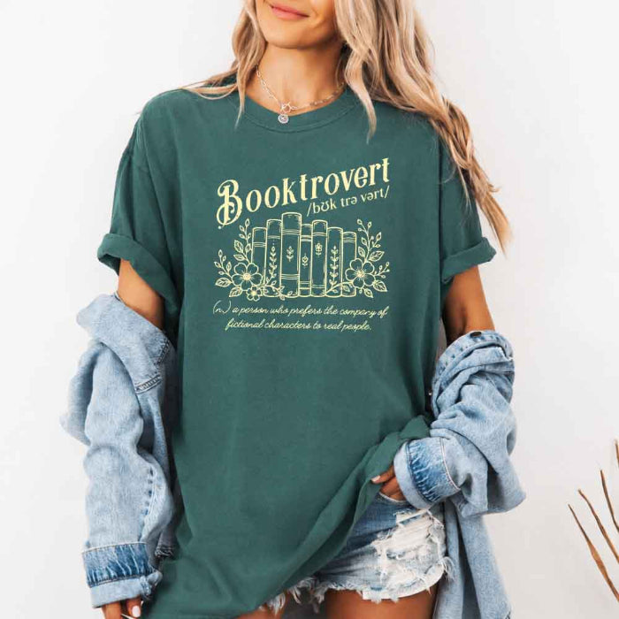 Booktrovert Comfort Colors T-shirt featuring a playful book lover graphic on a relaxed garment-dyed 100% cotton tee for readers and bookworms in color Blue Spruce