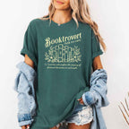 Booktrovert Comfort Colors T-shirt featuring a playful book lover graphic on a relaxed garment-dyed 100% cotton tee for readers and bookworms in color Blue Spruce