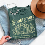 Booktrovert Comfort Colors T-shirt featuring a playful book lover graphic on a relaxed garment-dyed 100% cotton tee for readers and bookworms in color Blue Spruce