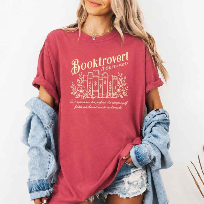 Booktrovert Comfort Colors T-shirt featuring a playful book lover graphic on a relaxed garment-dyed 100% cotton tee for readers and bookworms in color Crimson