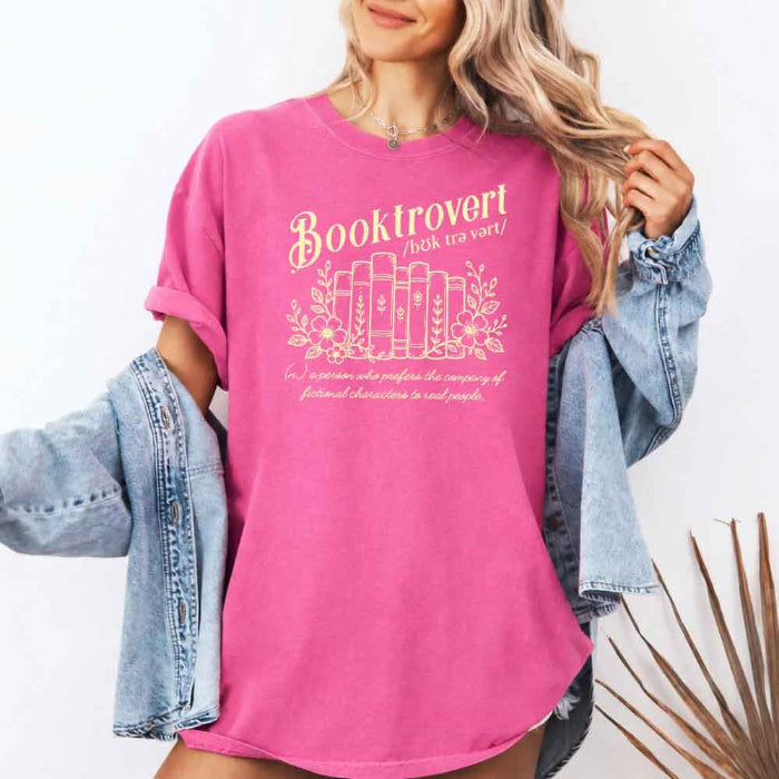 Booktrovert Comfort Colors T-shirt featuring a playful book lover graphic on a relaxed garment-dyed 100% cotton tee for readers and bookworms in color Crunchberry