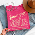 Booktrovert Comfort Colors T-shirt featuring a playful book lover graphic on a relaxed garment-dyed 100% cotton tee for readers and bookworms in color Crunchberry