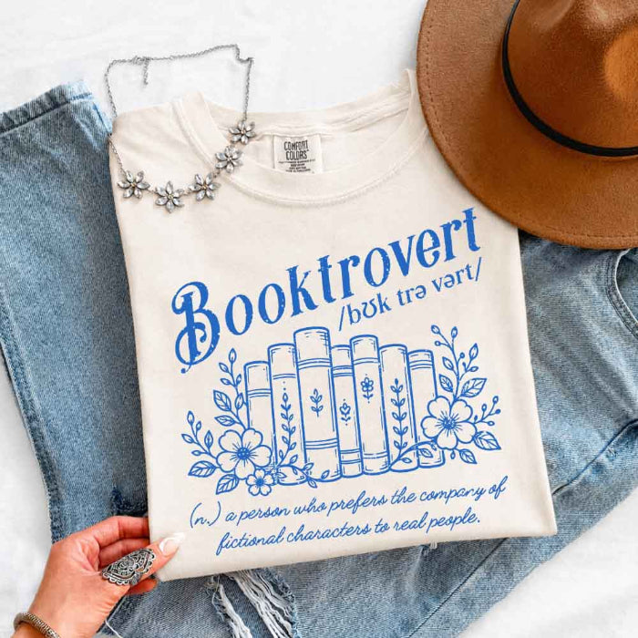 Booktrovert Comfort Colors T-shirt featuring a playful book lover graphic on a relaxed garment-dyed 100% cotton tee for readers and bookworms in color Ivory