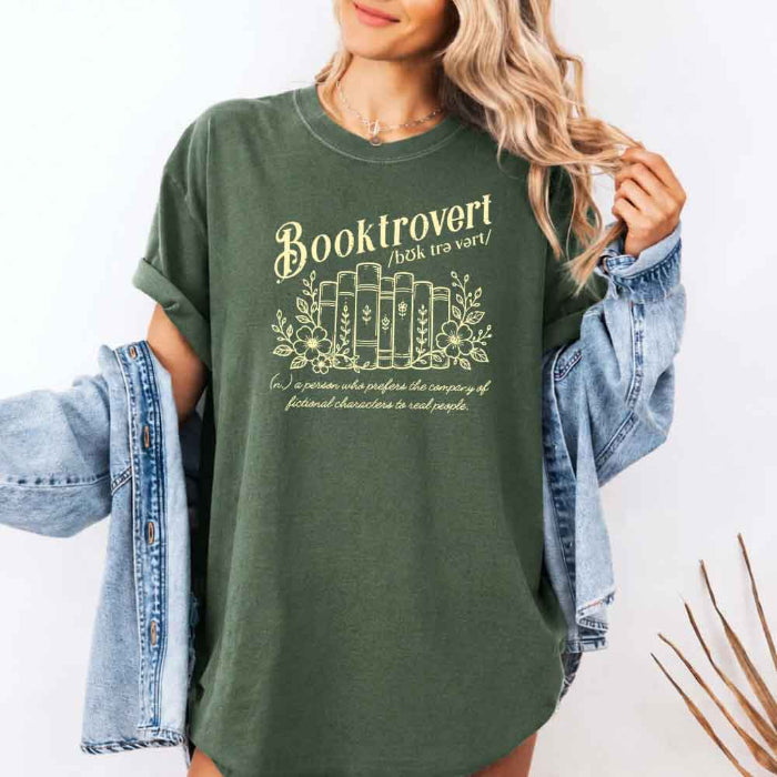 Booktrovert Comfort Colors T-shirt featuring a playful book lover graphic on a relaxed garment-dyed 100% cotton tee for readers and bookworms in color Moss