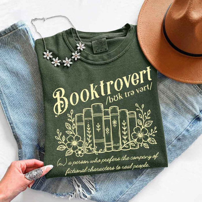 Booktrovert Comfort Colors T-shirt featuring a playful book lover graphic on a relaxed garment-dyed 100% cotton tee for readers and bookworms in color Moss