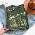 Booktrovert Comfort Colors T-shirt featuring a playful book lover graphic on a relaxed garment-dyed 100% cotton tee for readers and bookworms in color Moss