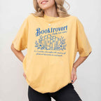 Booktrovert Comfort Colors T-shirt featuring a playful book lover graphic on a relaxed garment-dyed 100% cotton tee for readers and bookworms in color Mustard