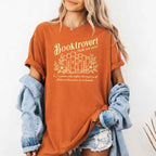 Booktrovert Comfort Colors T-shirt featuring a playful book lover graphic on a relaxed garment-dyed 100% cotton tee for readers and bookworms in color Yam