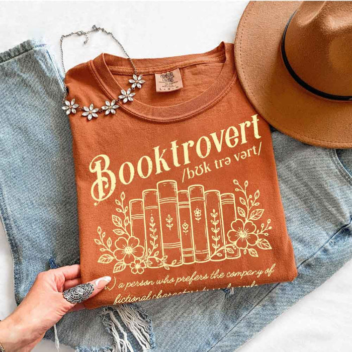 Booktrovert Comfort Colors T-shirt featuring a playful book lover graphic on a relaxed garment-dyed 100% cotton tee for readers and bookworms in color Yam