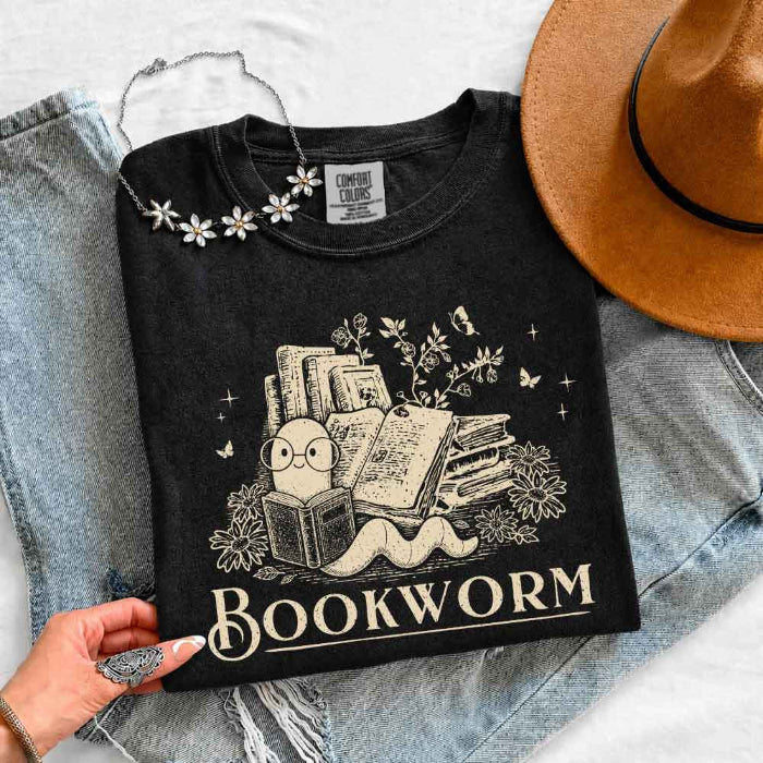 Bookworm Comfort Colors graphic T-shirt featuring a book lover design on a relaxed garment-dyed tee for readers and bookworms in Black