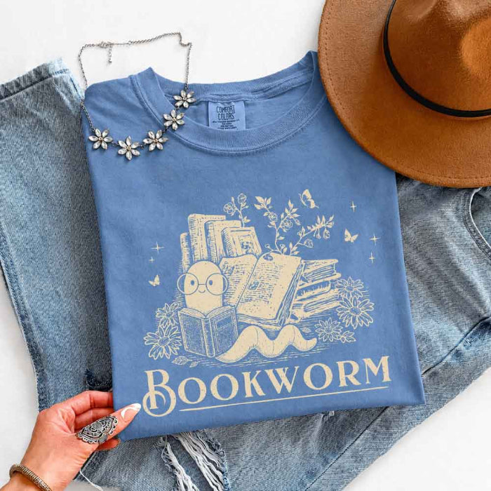 Bookworm Comfort Colors graphic T-shirt featuring a book lover design on a relaxed garment-dyed tee for readers and bookworms in Blue Jean