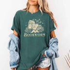 Bookworm Comfort Colors graphic T-shirt featuring a book lover design on a relaxed garment-dyed tee for readers and bookworms in Blue Spruce