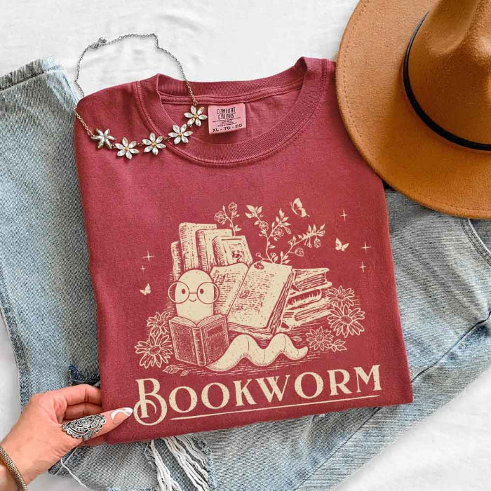 Bookworm Comfort Colors graphic T-shirt featuring a book lover design on a relaxed garment-dyed tee for readers and bookworms in Crimson