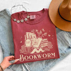 Bookworm Comfort Colors graphic T-shirt featuring a book lover design on a relaxed garment-dyed tee for readers and bookworms in Crimson