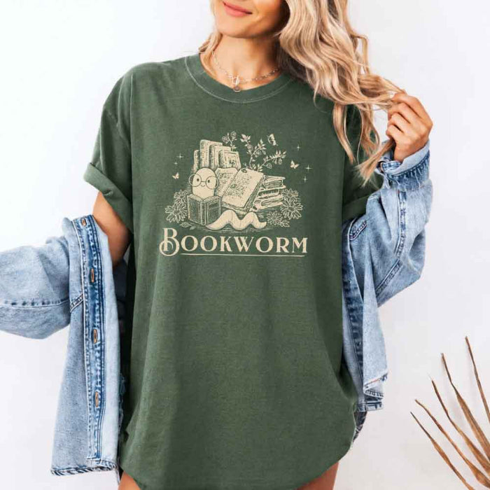 Bookworm Comfort Colors graphic T-shirt featuring a book lover design on a relaxed garment-dyed tee for readers and bookworms in Moss