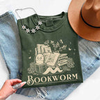 Bookworm Comfort Colors graphic T-shirt featuring a book lover design on a relaxed garment-dyed tee for readers and bookworms in Moss