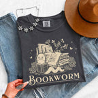 Bookworm Comfort Colors graphic T-shirt featuring a book lover design on a relaxed garment-dyed tee for readers and bookworms in Pepper