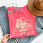 Bookworm Comfort Colors graphic T-shirt featuring a book lover design on a relaxed garment-dyed tee for readers and bookworms in Watermelon
