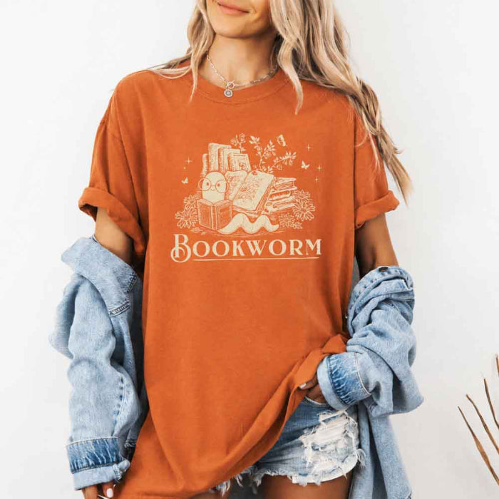 Bookworm Comfort Colors graphic T-shirt featuring a book lover design on a relaxed garment-dyed tee for readers and bookworms in Yam