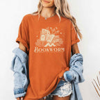 Bookworm Comfort Colors graphic T-shirt featuring a book lover design on a relaxed garment-dyed tee for readers and bookworms in Yam