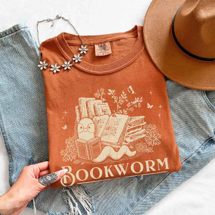 Bookworm Comfort Colors graphic T-shirt featuring a book lover design on a relaxed garment-dyed tee for readers and bookworms in Yam
