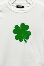 White Four Leaf Clover graphic print cotton t-shirt featuring a green lucky clover design