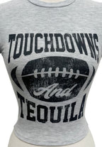 Touchdowns and Tequila graphic crop tee in grey featuring football-inspired game day graphic design