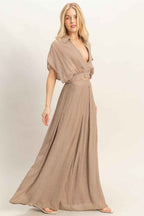 Women’s two-piece set featuring a cropped collared wrap top with soft pleating and coordinating flowy wide-leg pants in a lightweight cotton-rayon blend.