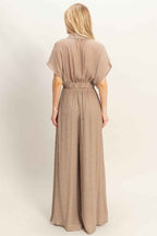 Women’s two-piece set featuring a cropped collared wrap top with soft pleating and coordinating flowy wide-leg pants in a lightweight cotton-rayon blend.
