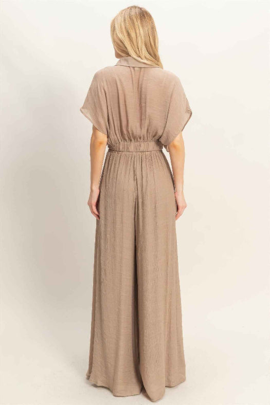Women’s two-piece set featuring a cropped collared wrap top with soft pleating and coordinating flowy wide-leg pants in a lightweight cotton-rayon blend.