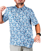 Men’s Coca-Cola golf polo from the official Coca-Cola x Pins & Aces collaboration featuring a blue and white all-over print with red accents and an athletic performance fit.