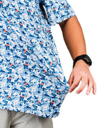 Men’s Coca-Cola golf polo from the official Coca-Cola x Pins & Aces collaboration featuring a blue and white all-over print with red accents and an athletic performance fit.