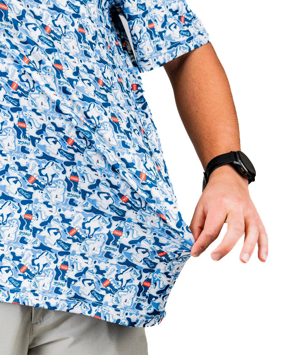 Men’s Coca-Cola golf polo from the official Coca-Cola x Pins & Aces collaboration featuring a blue and white all-over print with red accents and an athletic performance fit.