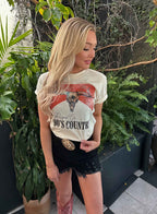 Raised On 90's Country Graphic Tee printed on premium Comfort Colors cotton, featuring an exclusive Willow Boutique design perfect for country concerts, rodeos, and everyday western-inspired style. 
