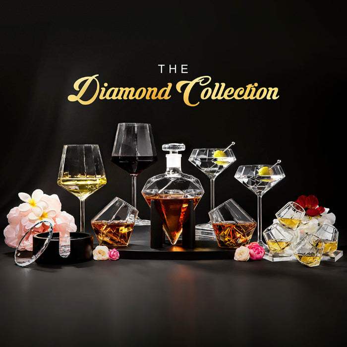 Set of four diamond-shaped stainless steel chilling stones by Dragon Glassware designed to cool whiskey and other beverages without melting or diluting drinks.