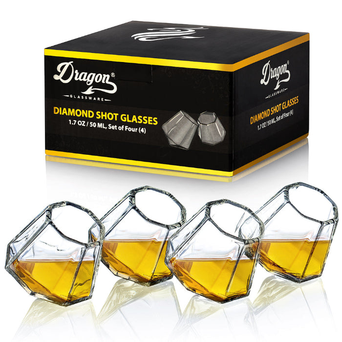 Set of clear diamond-shaped 2 oz shot glasses by Dragon Glassware featuring a unique geometric design that rests at a tilted angle.