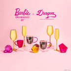 Set of two Barbie™ x Dragon Glassware® Dreamhouse™ 17.5 oz stemmed wine glasses with metallic gold exteriors, pink interiors, Barbie™ logo bases, and pink gift box.