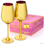 Set of two Barbie™ x Dragon Glassware® Dreamhouse™ 17.5 oz stemmed wine glasses with metallic gold exteriors, pink interiors, Barbie™ logo bases, and pink gift box.