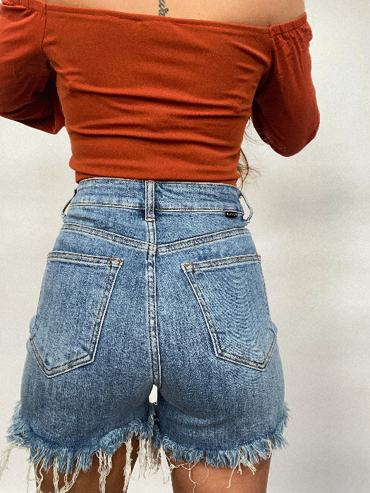 On The Go Medium Wash Distressed Shorts – High Rise