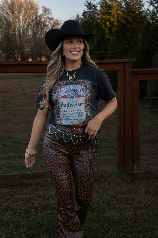 King of Beers Graphic Tee made from soft 100% cotton featuring a vintage-inspired beer graphic, perfect for tailgates, BBQs, brewery visits, country concerts, and casual everyday style. Color Black