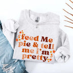 Feed Me Pie and Tell Me I’m Pretty funny Thanksgiving sweatshirt featuring a fall pie lover graphic on a cozy unisex crewneck in Ash