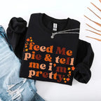 Feed Me Pie and Tell Me I’m Pretty funny Thanksgiving sweatshirt featuring a fall pie lover graphic on a cozy unisex crewneck in Black