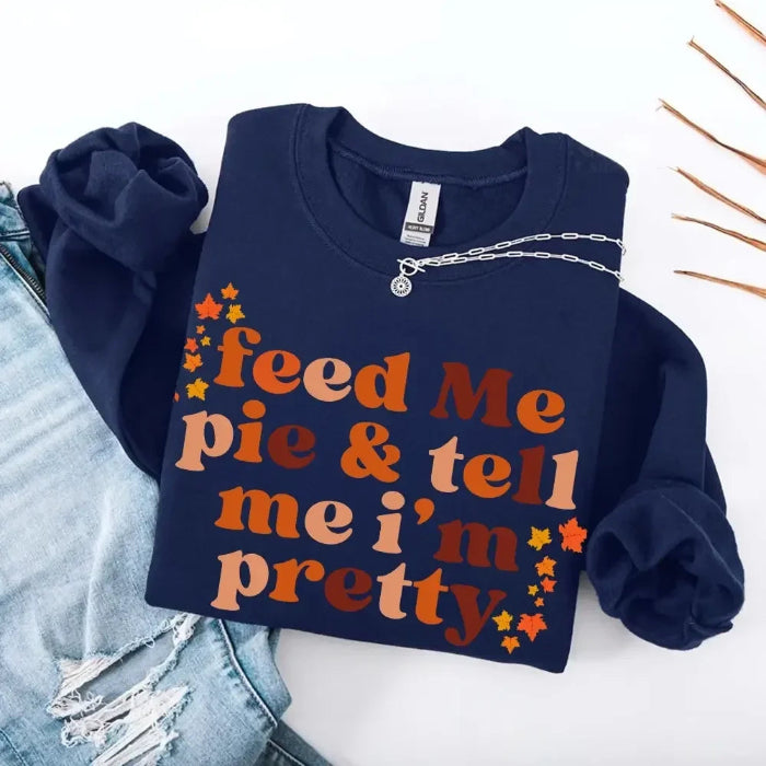 Feed Me Pie and Tell Me I’m Pretty funny Thanksgiving sweatshirt featuring a fall pie lover graphic on a cozy unisex crewneck in Navy Blue