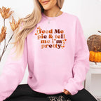 Feed Me Pie and Tell Me I’m Pretty funny Thanksgiving sweatshirt featuring a fall pie lover graphic on a cozy unisex crewneck in Light Pink