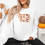 Feed Me Pie and Tell Me I’m Pretty funny Thanksgiving sweatshirt featuring a fall pie lover graphic on a cozy unisex crewneck in White