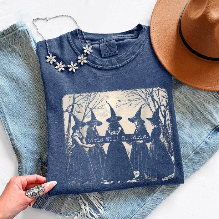 Girls Will Be Girls Comfort Colors graphic T-shirt with a playful Halloween-inspired design for spooky season in Denim